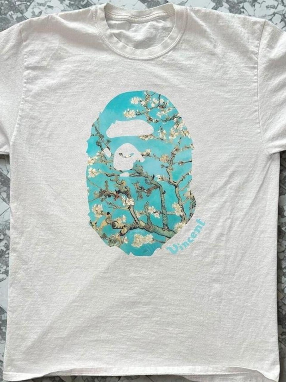 White Graphic Tee with Turquoise Floral Ape Design